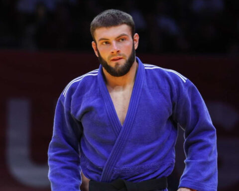 Serbian judoka Boris Rutović wearing a blue judo uniform and black belt during a competition.