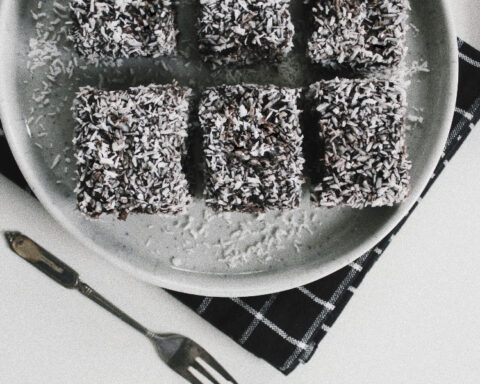 Traditional Yugoslav čupavci chocolate coconut cake squares served on a plate.