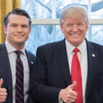 U.S. Defense Secretary Pete Hegseth and President Donald Trump posing together and giving thumbs-up gestures.