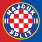 Official Hajduk Split football club crest against a red and blue background.