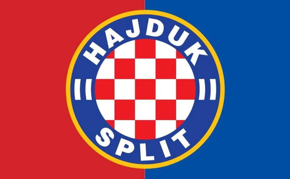 Official Hajduk Split football club crest against a red and blue background.