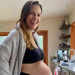 Hilary Swank pregnant with her third child, showing her baby bump in a photo shared on Instagram.