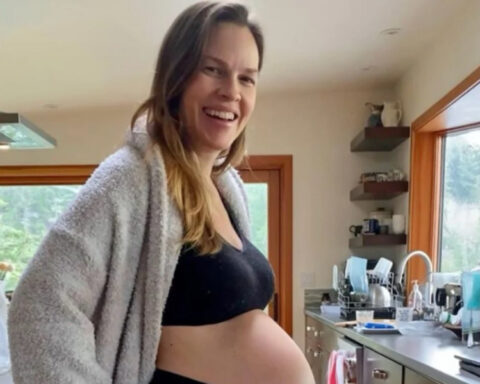 Hilary Swank pregnant with her third child, showing her baby bump in a photo shared on Instagram.