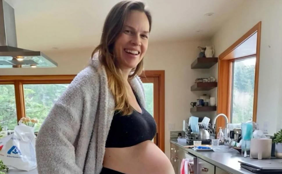 Hilary Swank pregnant with her third child, showing her baby bump in a photo shared on Instagram.