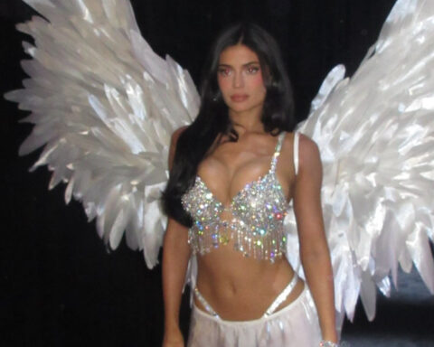 Kylie Jenner wearing a diamond-encrusted Fantasy Bra, large white feathered wings and a white skirt at the Victoria’s Secret Fashion Show 2026.