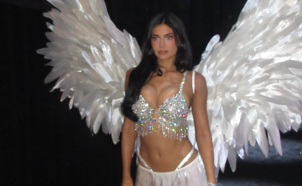 Kylie Jenner wearing a diamond-encrusted Fantasy Bra, large white feathered wings and a white skirt at the Victoria’s Secret Fashion Show 2026.