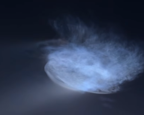Space jellyfish glowing in the night sky after a SpaceX Falcon 9 rocket launch, creating a bright blue cloud.