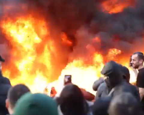 Large flames and thick smoke rise as protesters gather during anti-government demonstrations in Tirana, Albania.