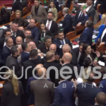 Albanian lawmakers confront each other during a heated parliamentary session in Tirana.