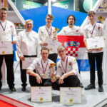 Croatian chefs displaying their medals, trophies and certificates at the Global Chefs Challenge competition in Belgrade.