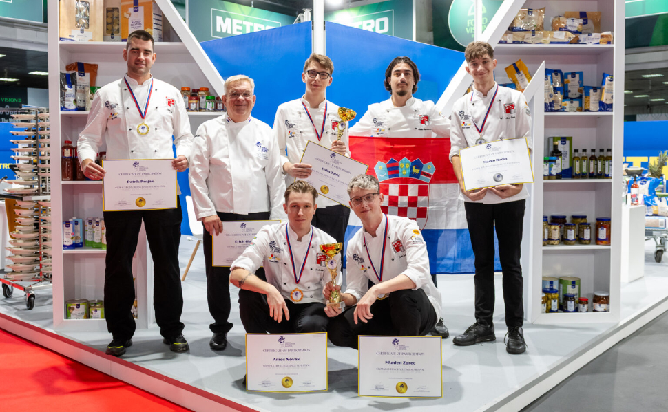 Croatian chefs displaying their medals, trophies and certificates at the Global Chefs Challenge competition in Belgrade.