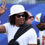 Jay-Z wearing a white hat and sunglasses ahead of the FIFA World Cup match between Côte d’Ivoire and Ecuador in Philadelphia.