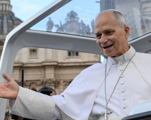 Pope Leo XIV greeting the faithful from the popemobile at the Vatican.