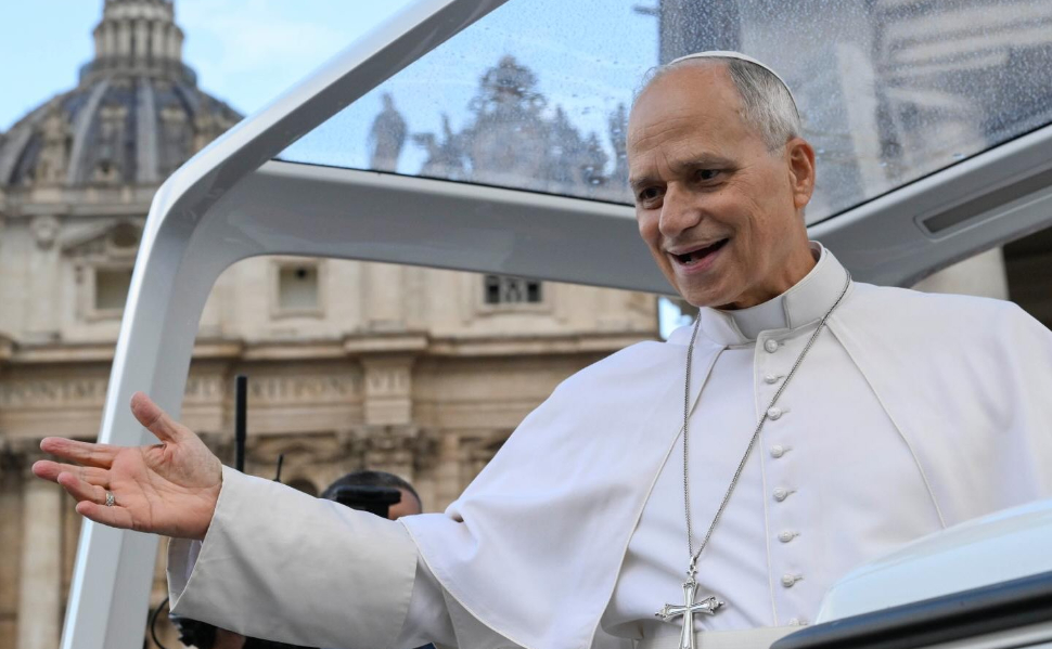 Pope Leo XIV greeting the faithful from the popemobile at the Vatican.