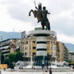 Macedonia Square in Skopje, Macedonia, with the Warrior on a Horse monument, fountains and buildings in the city center.