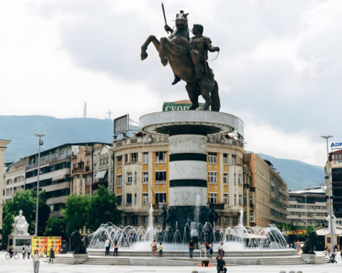 Macedonia Square in Skopje, Macedonia, with the Warrior on a Horse monument, fountains and buildings in the city center.