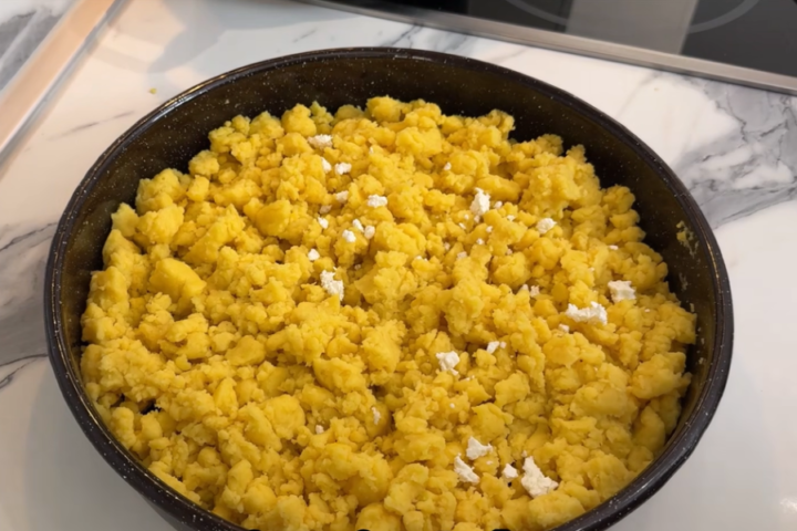 Traditional Macedonian kachamak made from yellow cornmeal and topped with crumbled white cheese.