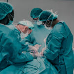 Medical team performing surgery in a hospital operating room