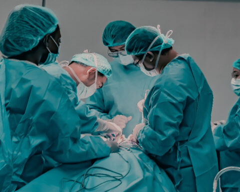 Medical team performing surgery in a hospital operating room