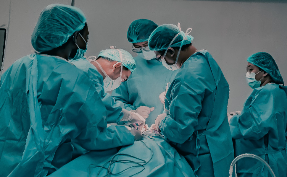 Medical team performing surgery in a hospital operating room