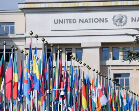 International flags, including the flag of Bosnia and Herzegovina, outside a United Nations building.