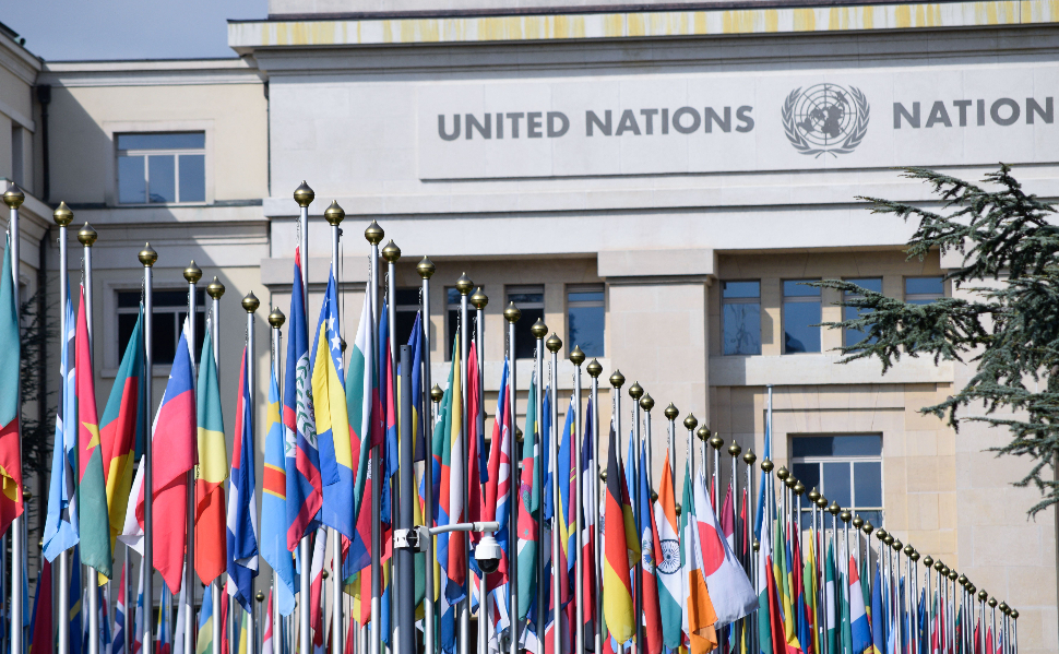 International flags, including the flag of Bosnia and Herzegovina, outside a United Nations building.